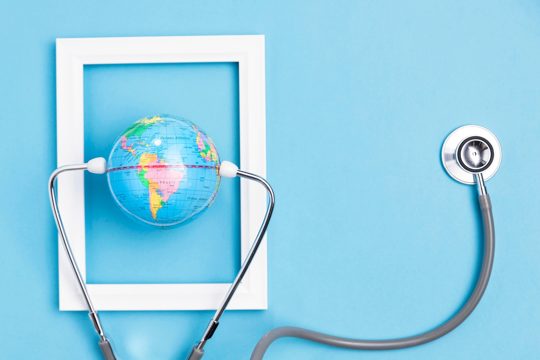 Top view of earth globe in frame with stethoscope
