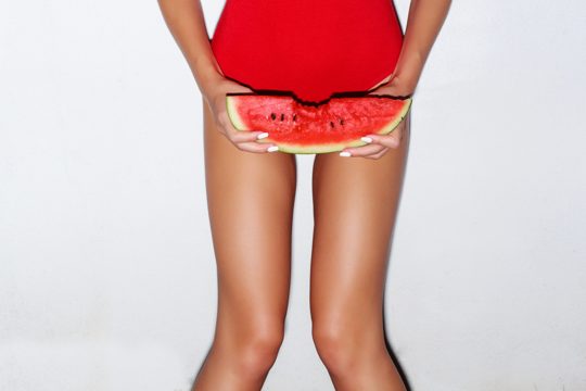 Close-up of girl holding a slice of watermelon