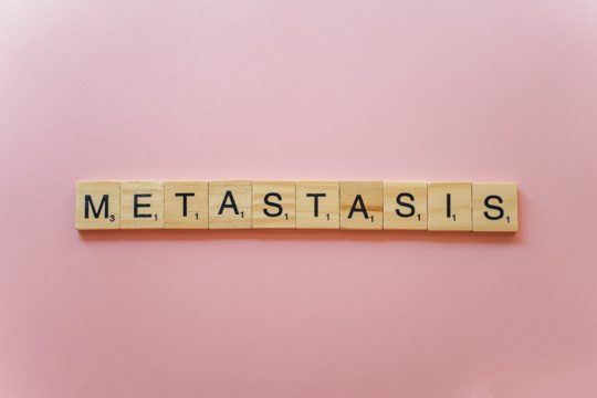 Metastasis Spelled on Wooden Scrabble Tiles