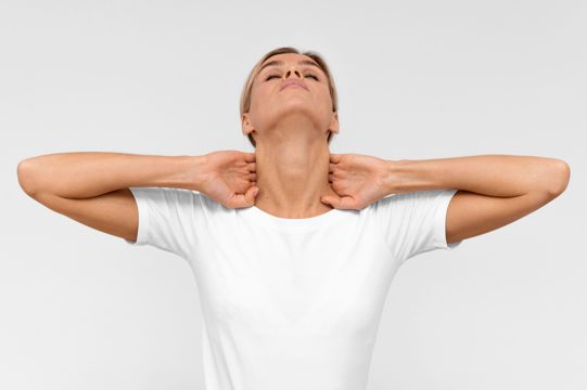Front view of woman doing physiotherapy exercises for neck
