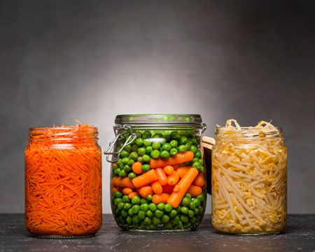 Assortment of vegetables pickled in glass jars